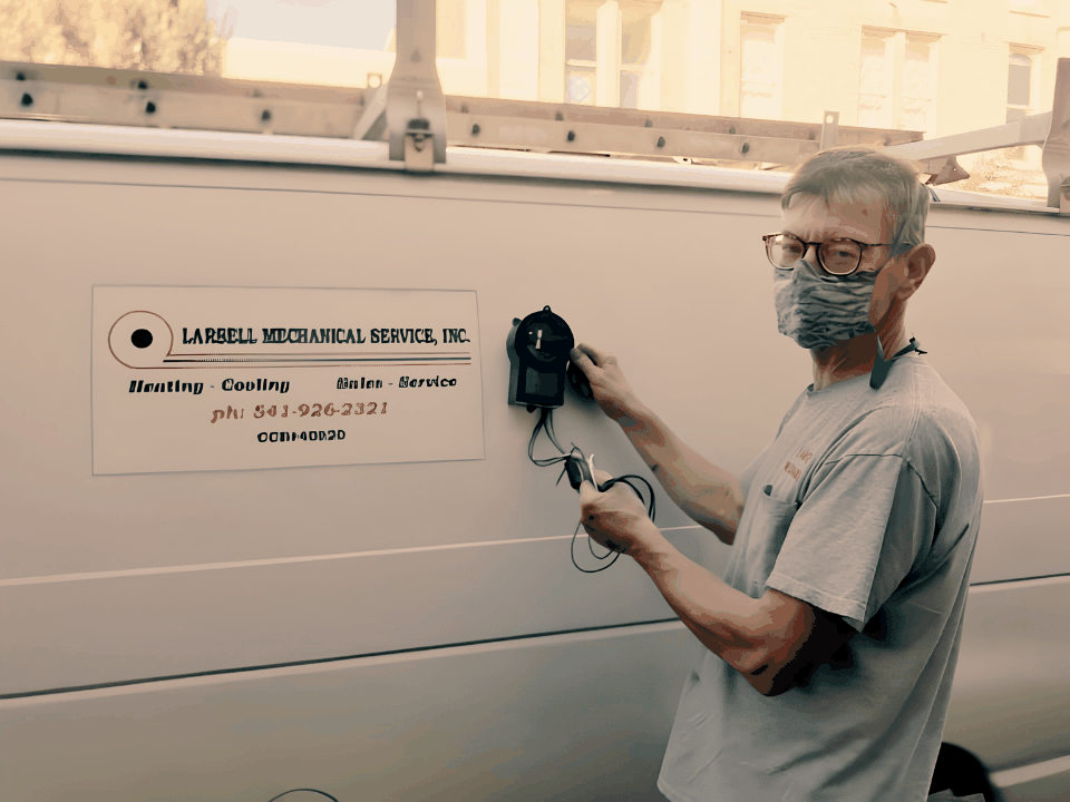 R. Dennis Larsell with the original Tru72 van, carrying the family standard forward.